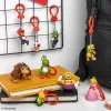 „Backpack Buddies“ raktų pakabukų rinkinys Paladone Super Mario, CDU, 24 vnt. – įvairūs veikėjai, kolekcionuojami aksesuarai