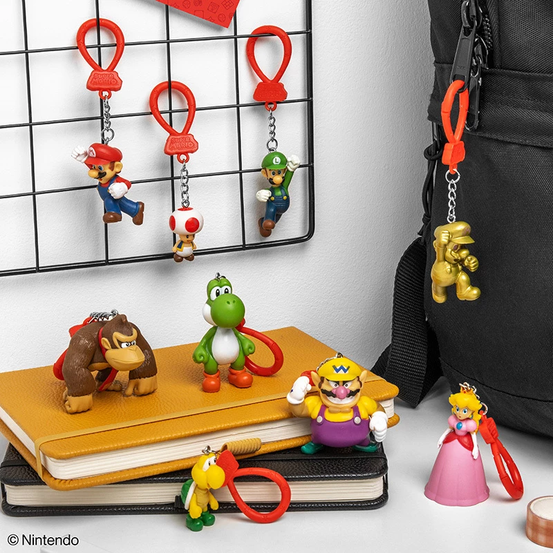 „Backpack Buddies“ raktų pakabukų rinkinys Paladone Super Mario, CDU, 24 vnt. – įvairūs veikėjai, kolekcionuojami aksesuarai