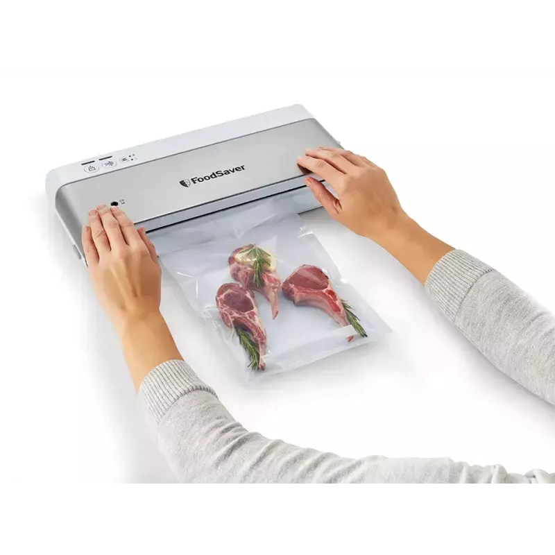 Vakuuminis pakuotuvas FoodSaver VS0100X – sukamasis valdymas, komplekte ritinys ir 4 maišeliai, sidabriškai baltas