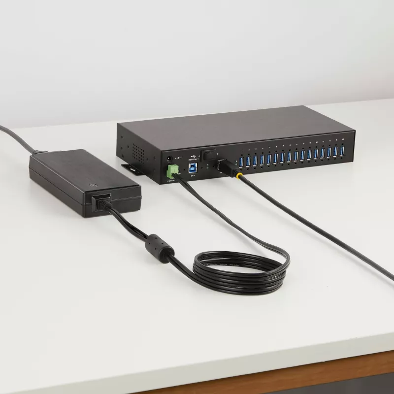 StarTech.com 16 prievadų pramoninis USB 5Gbps centras su maitinimo adapteriu, metaliniu korpusu, tvirtinimo galimybėmis, ESD apsauga, gnybtų bloko maitinimu, USB įkrovimu, dviejų pagrindinių kompiuterių perjungimu - TAA