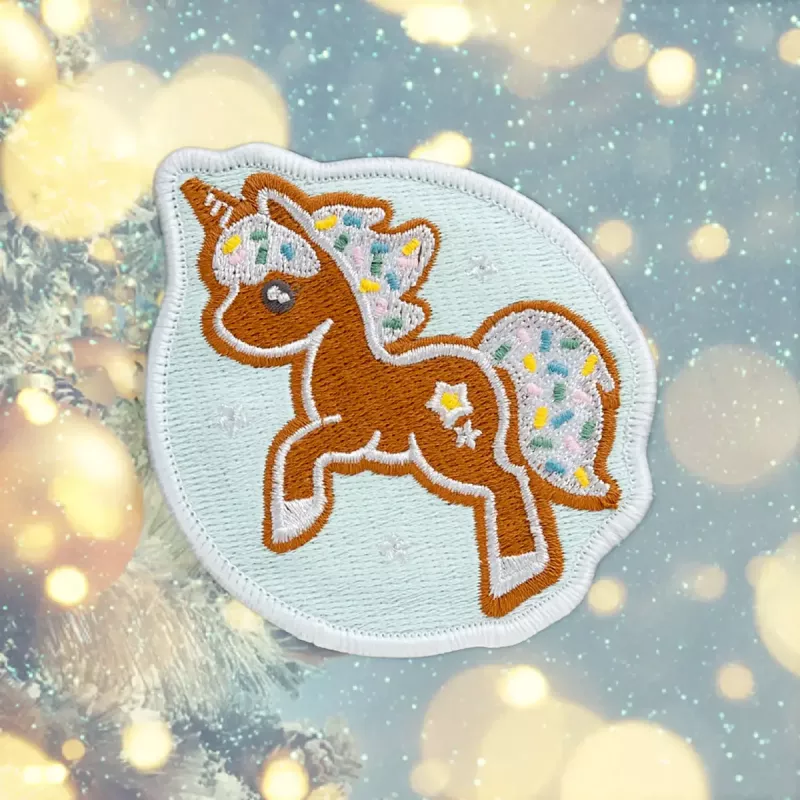 LAUT MAGMOJI BADGE – Unicorn Cookie Christmas Edition, PVC ir silikonas, ruda/šviesiai mėlyna, 1 vnt.