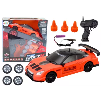 LEAN TOYS nuotoliniu valdymu sportinis automobilis 1:24 oranžinis su keičiamais ratais