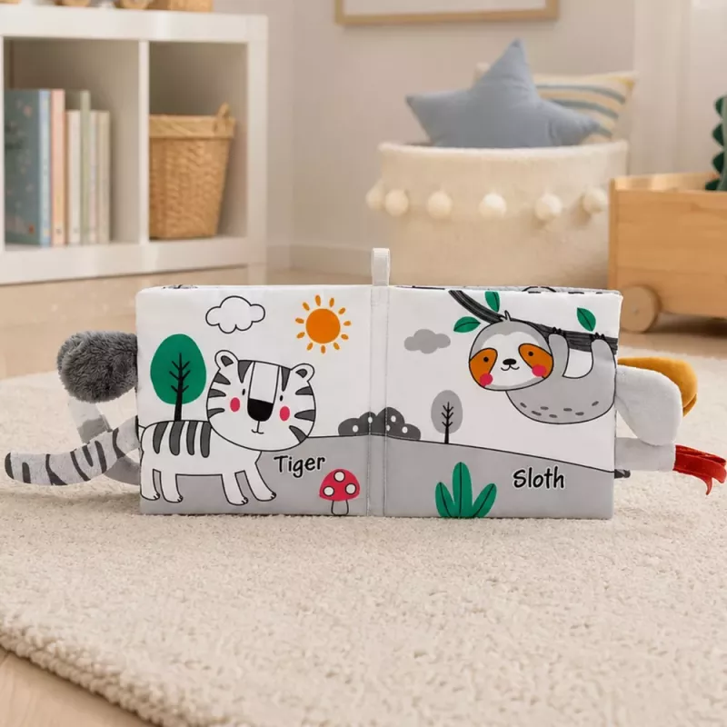 LEAN TOYS Minkštas sensorinis knygelė su ošiančiu ir cypsančiu drambliuku, pilka