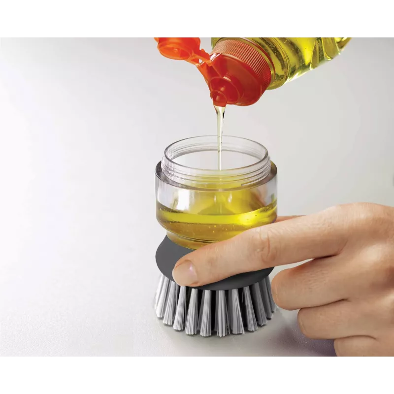 Joseph Joseph Palm Scrub Grey indų plovimo šepetys su integruotu muilo dozatoriumi