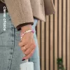 Crong Phone Charm Lanyard su pasteliniais karoliukais – universalus riešo dirželis išmaniesiems telefonams