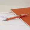Schneider Epsilon apvalusis rašiklis oranžinis su mėlynu rašalu 138606