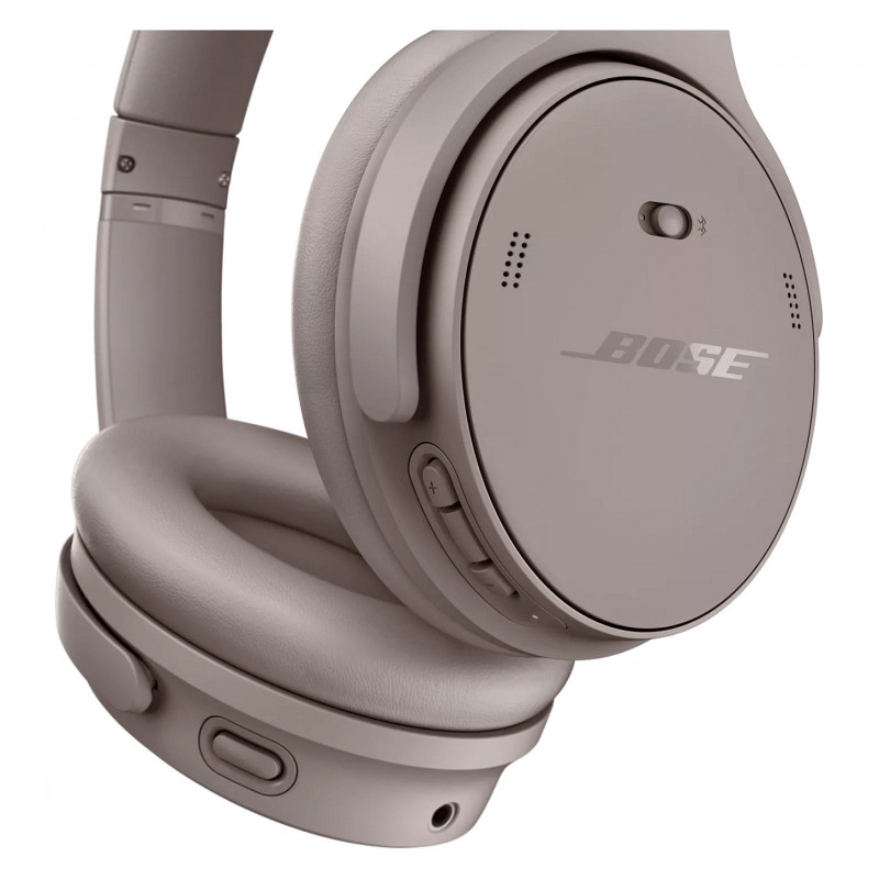 Bose QuietComfort triukšmą slopinančios ausinės ant ausų – smėlio spalvos