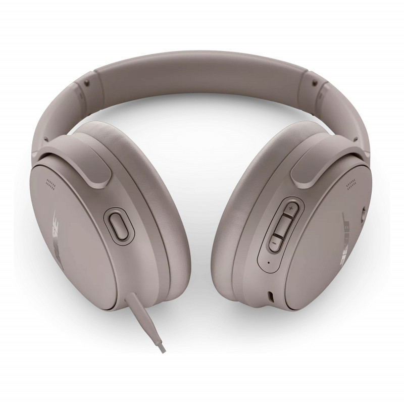 Bose QuietComfort triukšmą slopinančios ausinės ant ausų – smėlio spalvos
