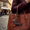 TFO Universal Phone Chain su taksų motyvu, ruda, 150 cm, reguliuojamas kryžminis dirželis su inkarėliu